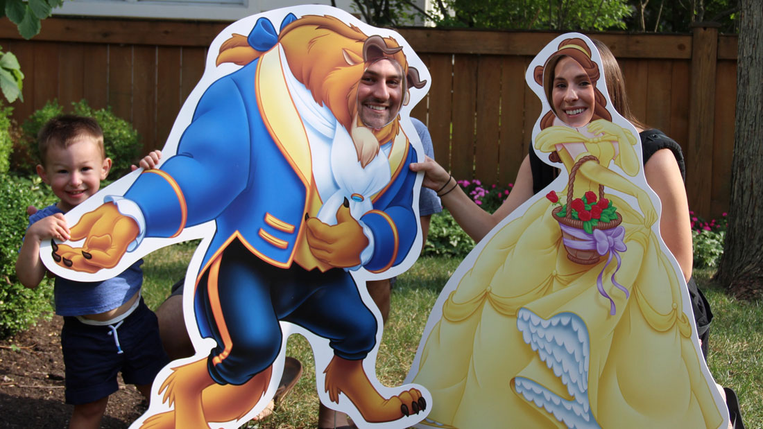 beauty and the beast face in hole life-size cutout bannerville family birthday party